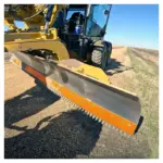 Scarifier Board and Bits on motor grader close-up