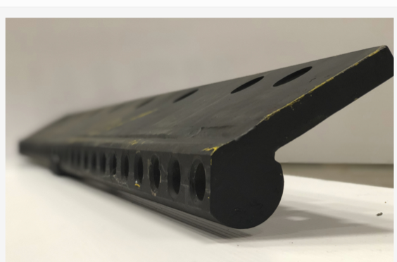 A scarifier board viewed from the side.
